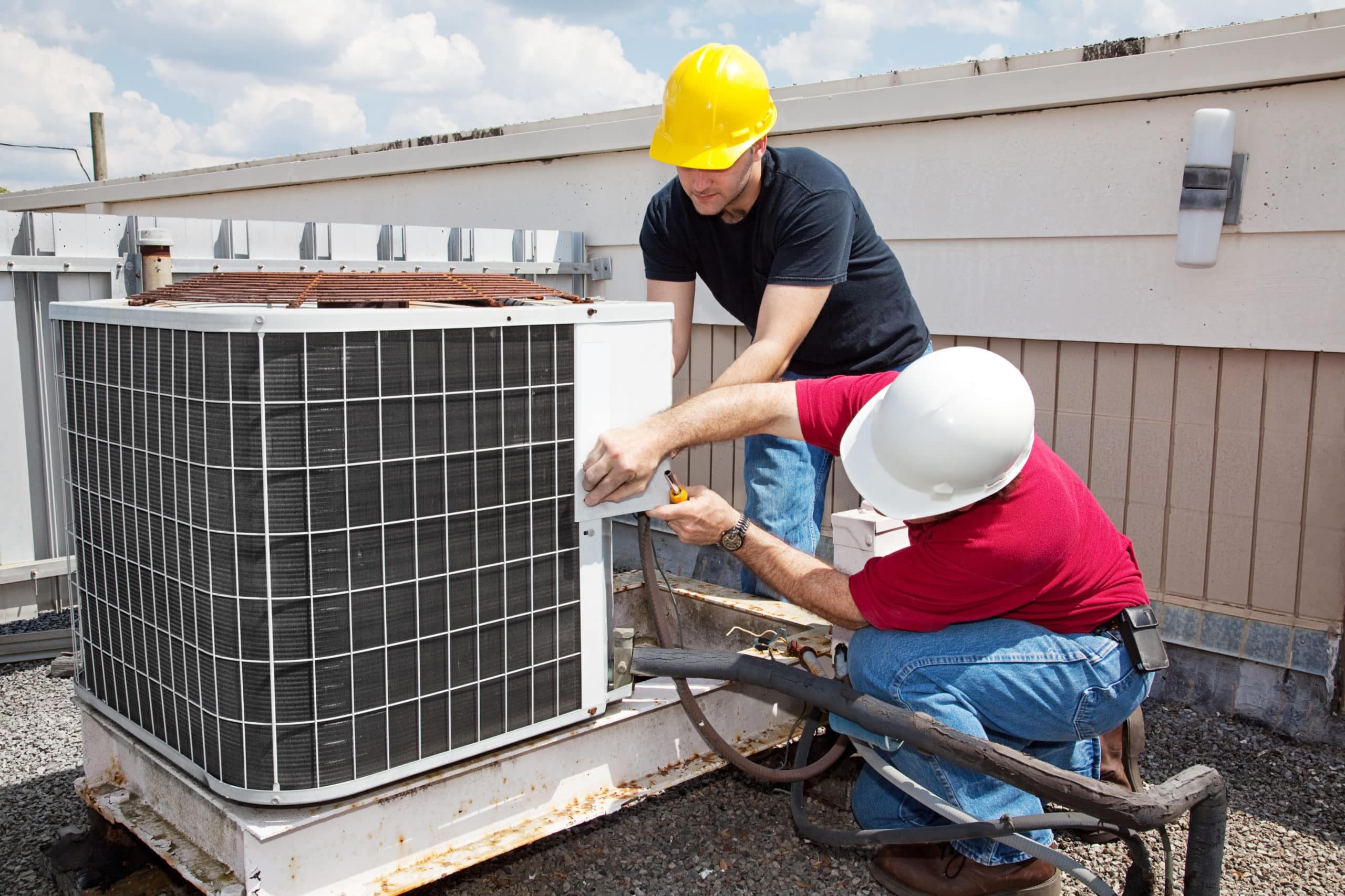 HVAC technicians on a rooftop